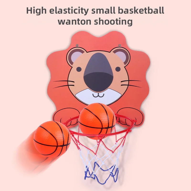 3-8 year old boy shooting a small basketball