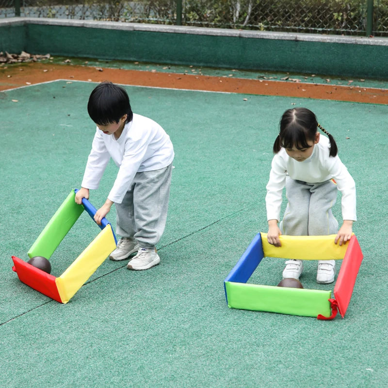 Kindergarten kids using jump frames in group activity