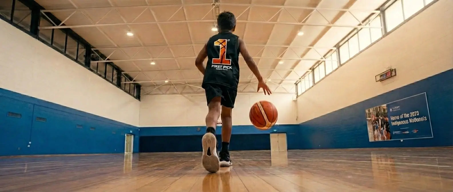 An inspiring view of the First Pick basketball court in Clayton, inviting parents to book a trial session for kids basketball development.