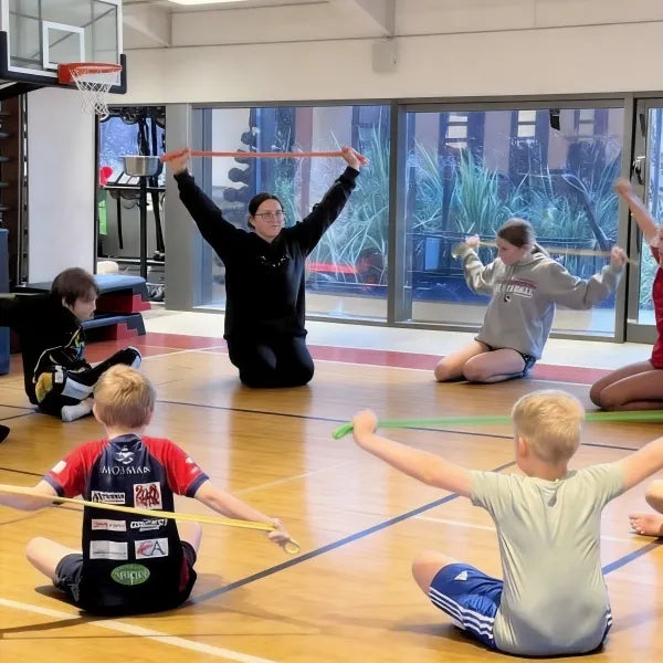A 4-year-old child performing flexibility and balance drills as part of the 5+3 scientific curriculum