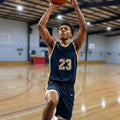 An intense, close-up shot of a focused youth basketball player performing a low dribble at a First Pick EDP assessment session in Wheelers Hill. The image highlights the player's concentration and elite skill level.
