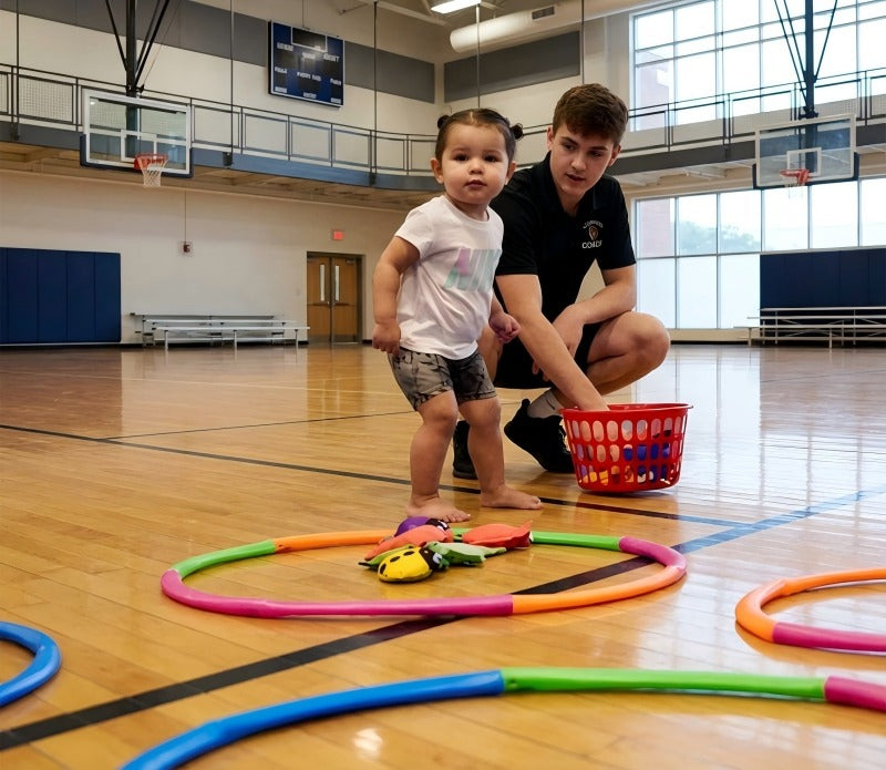 A young child exploring soccer during the multi-sport rotation phase to build a broad athletic vocabulary.