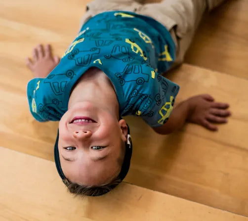 A professional portrait of David, a Box Hill parent, engaged in a conversation with a coach, highlighting the collaborative and expert-led environment of First Pick’s basketball program